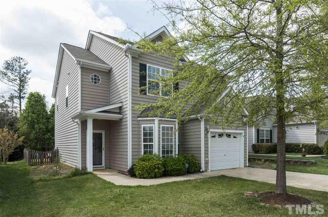 8417 Whisper Ridge Place Raleigh, NC 27613 - Photo 1 of 24 a view of a house with a yard and plants