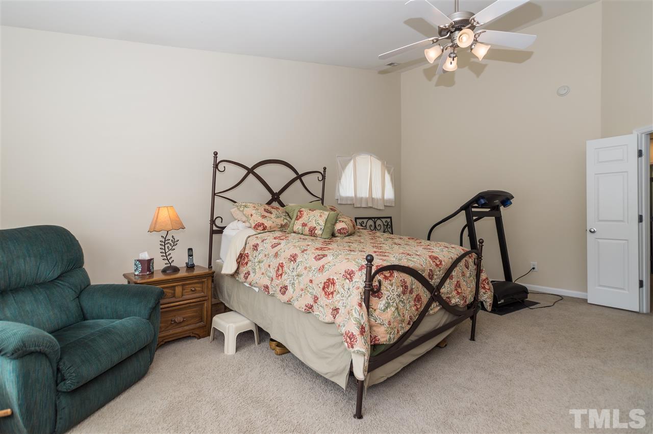 8417 Whisper Ridge Place Raleigh, NC 27613 - Photo 12 of 24 a bedroom with bed and window