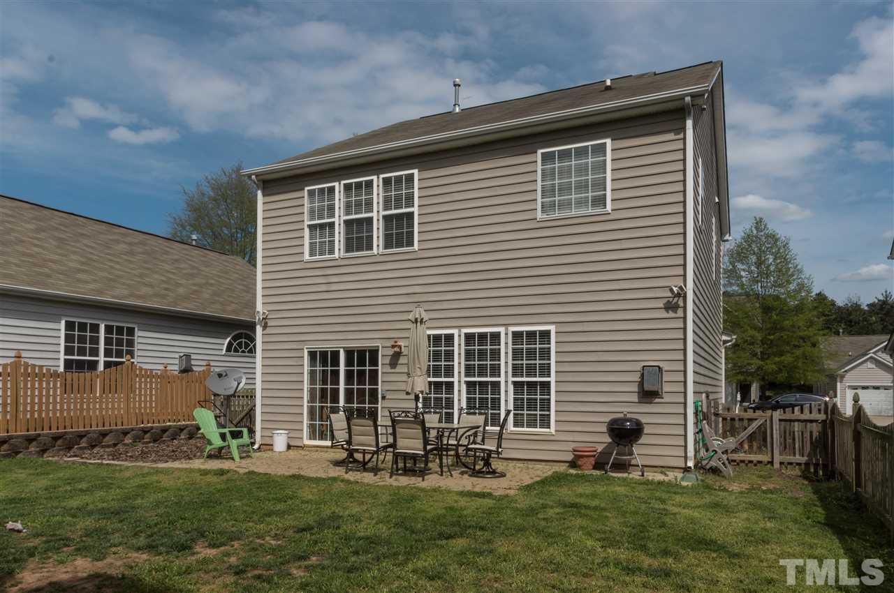 8417 Whisper Ridge Place Raleigh, NC 27613 - Photo 20 of 24 a front view of a house with a yard