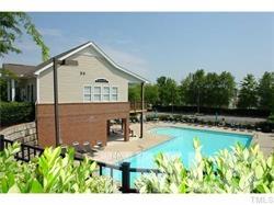 8417 Whisper Ridge Place Raleigh, NC 27613 - Photo 22 of 24 a view of a house with swimming pool and sitting area