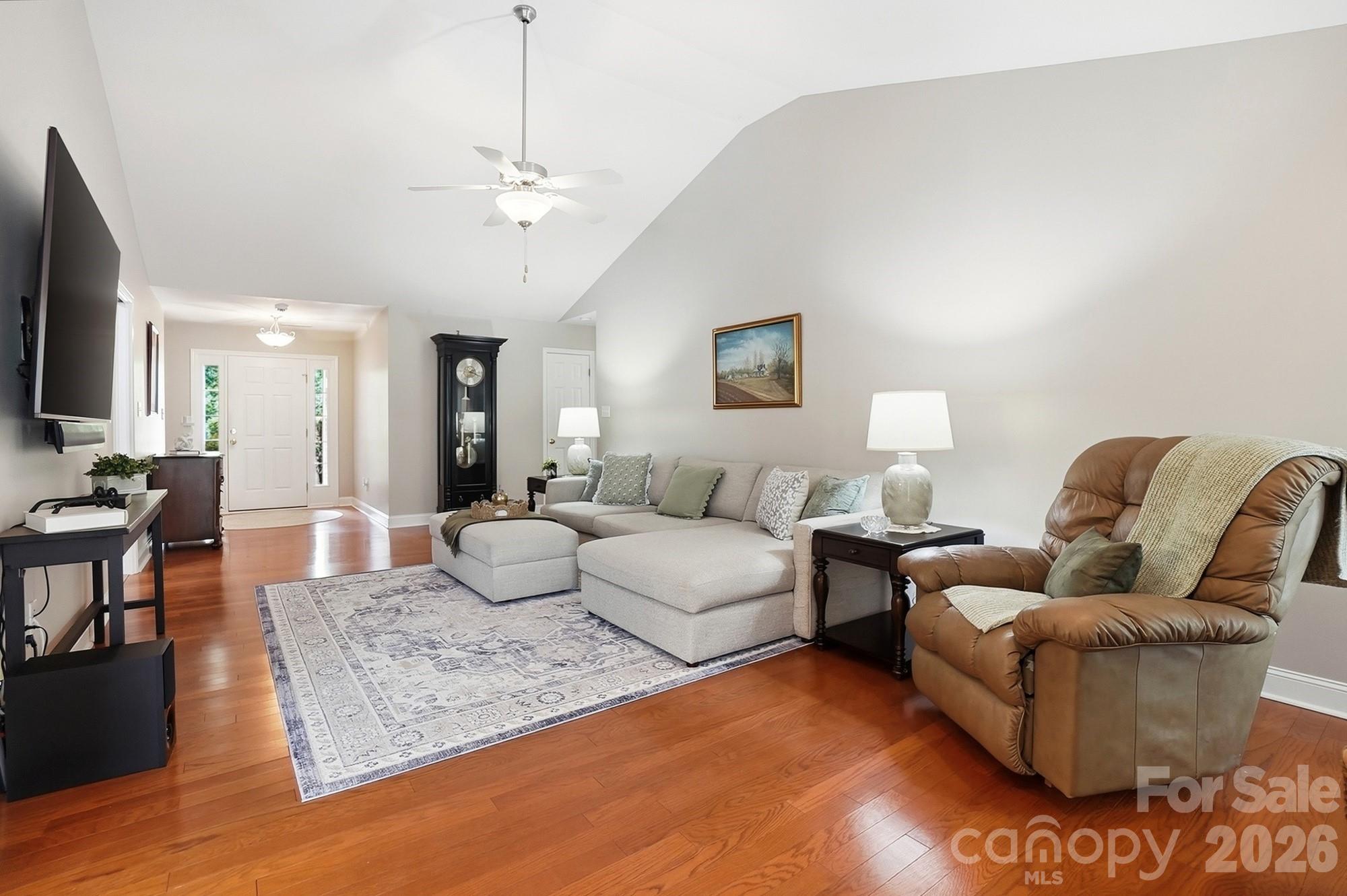 3324 Muddy Creek Road Midland, NC 28107 - Photo 8 of 46 a living room with furniture wooden floor and a flat screen tv