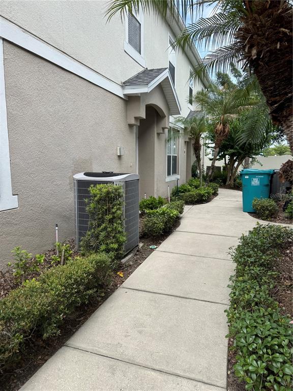 6404 South Goldenrod Road, Unit 2A Orlando, FL 32822 - Photo 4 of 40 a view of a house with a yard and potted plants