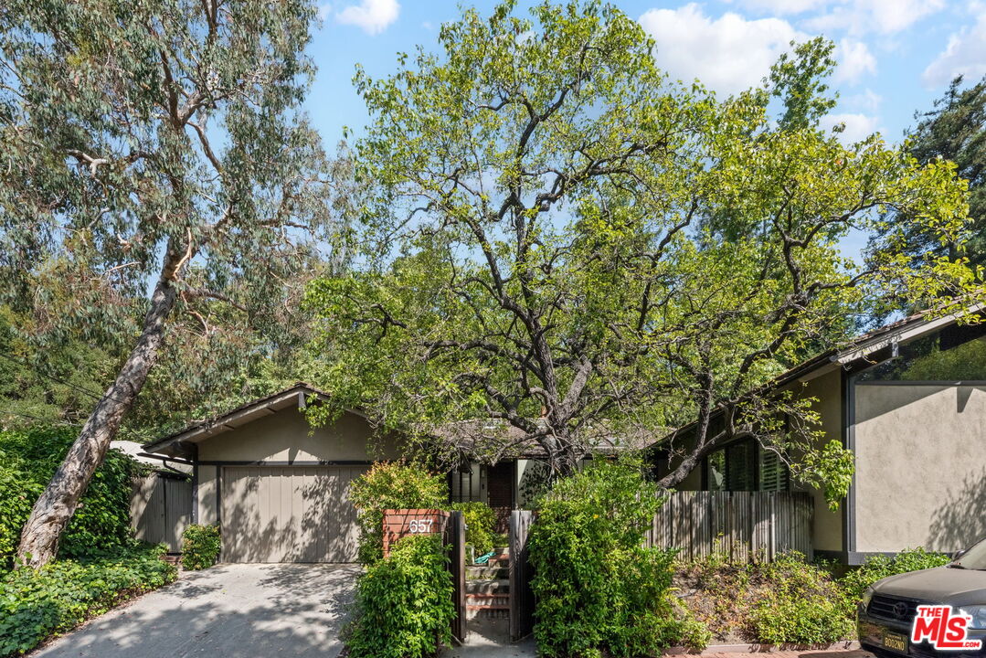 657 Hightree Road Santa Monica, CA 90402 - Photo 1 of 31 a backyard of a house with lots of green space