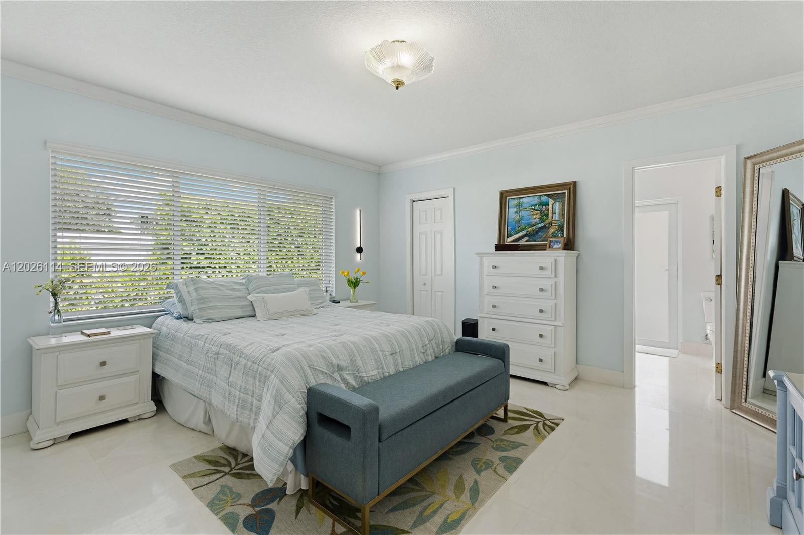 9641 Southwest 66th Street Miami, FL 33173 - Photo 27 of 57 a bedroom with a bed and a flat screen tv