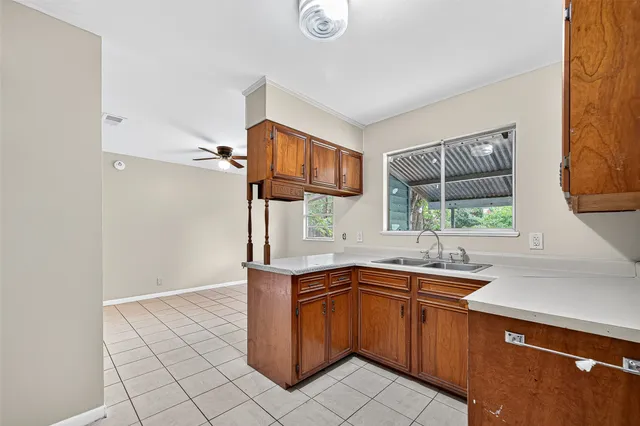 a kitchen with a sink and cabinets