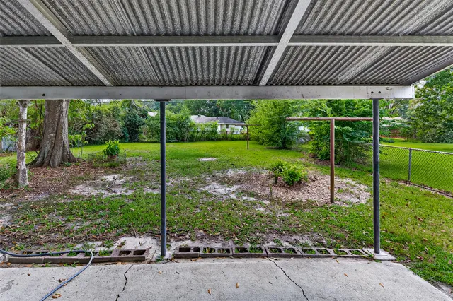 a view of a backyard with plants and outdoor space