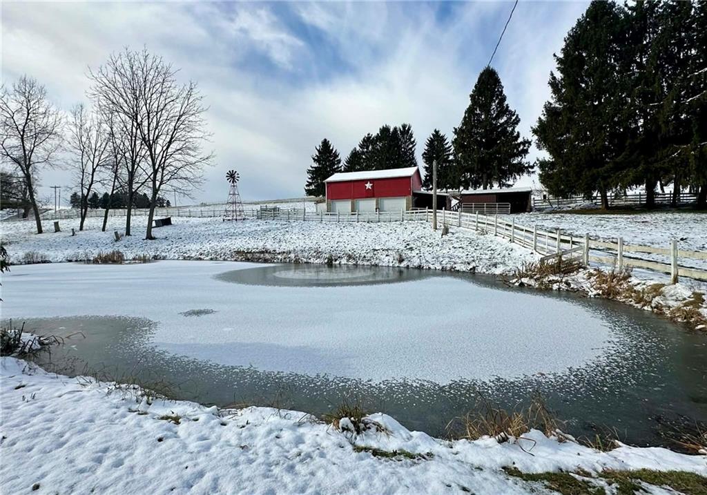 235 Hinchberger Road Butler, PA 16002 - Photo 2 of 40 a view of a lake with a mountain
