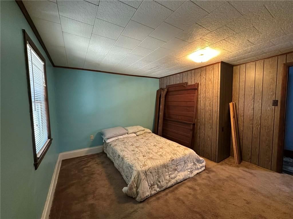 235 Hinchberger Road Butler, PA 16002 - Photo 22 of 40 a bedroom with a bed and a mirror