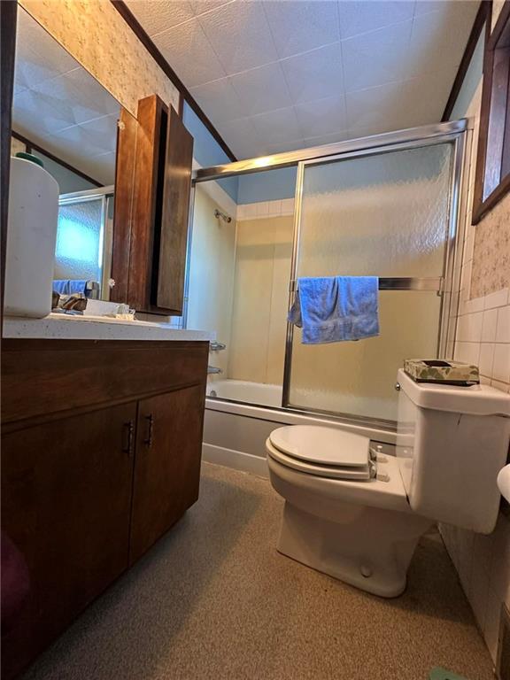 235 Hinchberger Road Butler, PA 16002 - Photo 26 of 40 a bathroom with a toilet a sink and a mirror