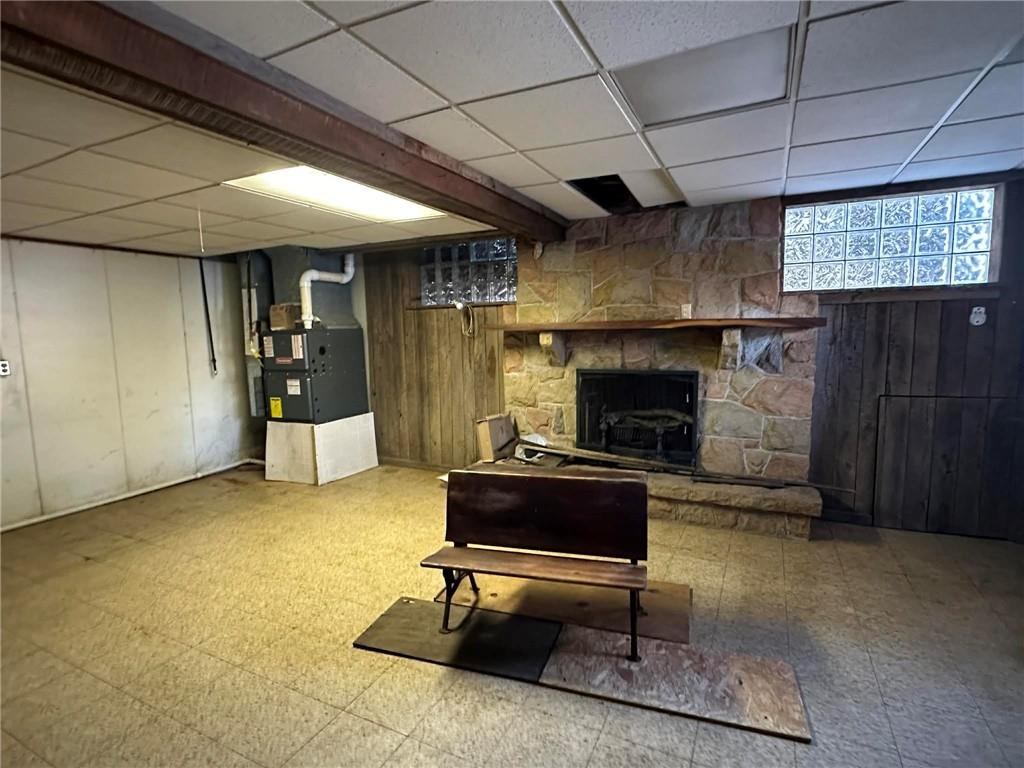 235 Hinchberger Road Butler, PA 16002 - Photo 27 of 40 a living room with furniture and a fireplace