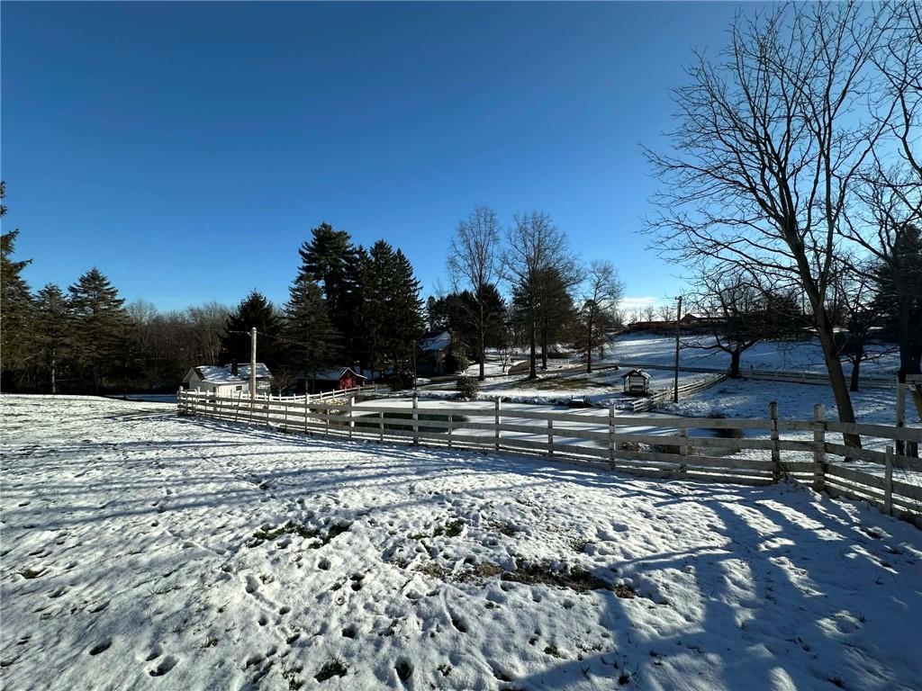 235 Hinchberger Road Butler, PA 16002 - Photo 4 of 40 a view of a yard with wooden fence