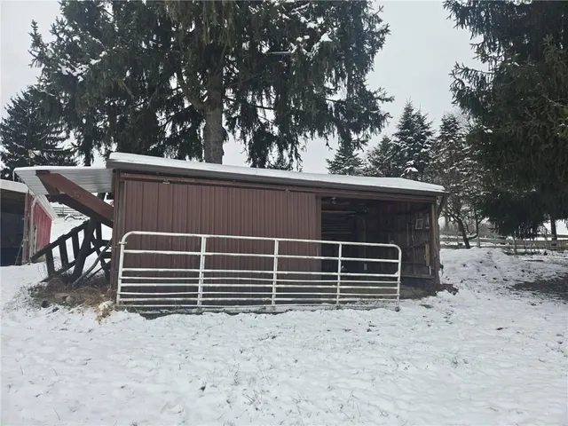 a view of house with trees in the background