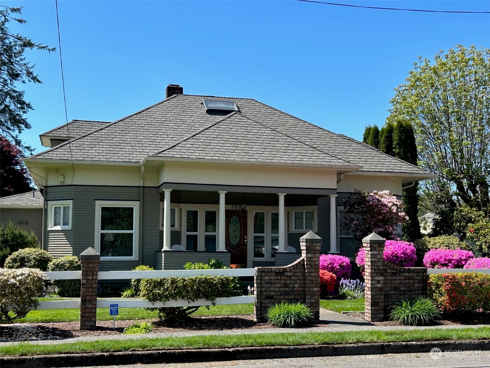 a front view of house with an outdoor seating