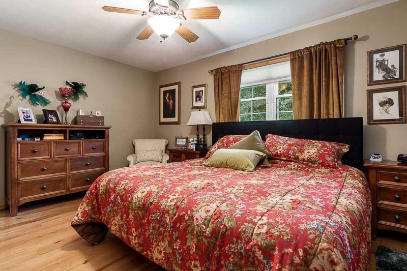 8410 Forest Preserve Road Durand, IL 61024 - Photo 15 of 37 a bedroom with a large bed and a window