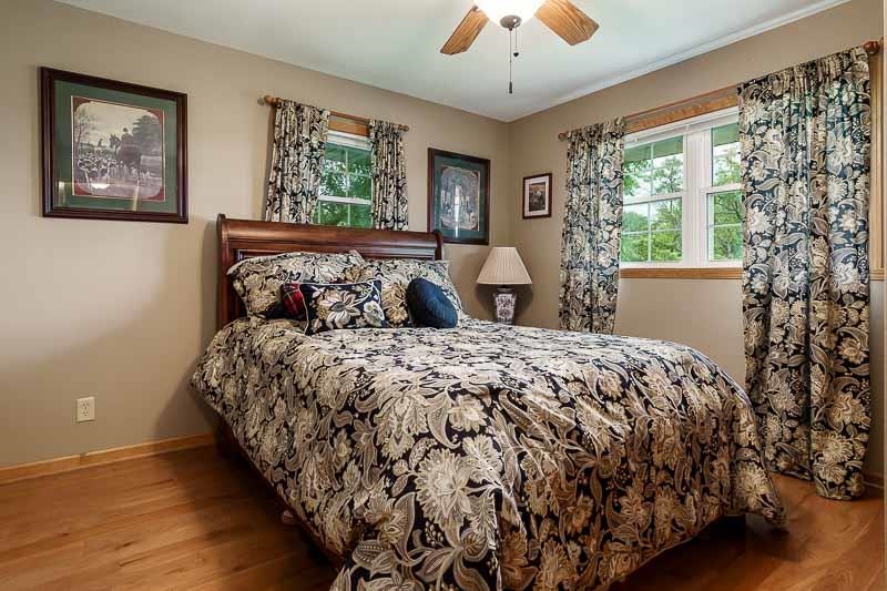 8410 Forest Preserve Road Durand, IL 61024 - Photo 16 of 37 a bedroom with a large bed and a window