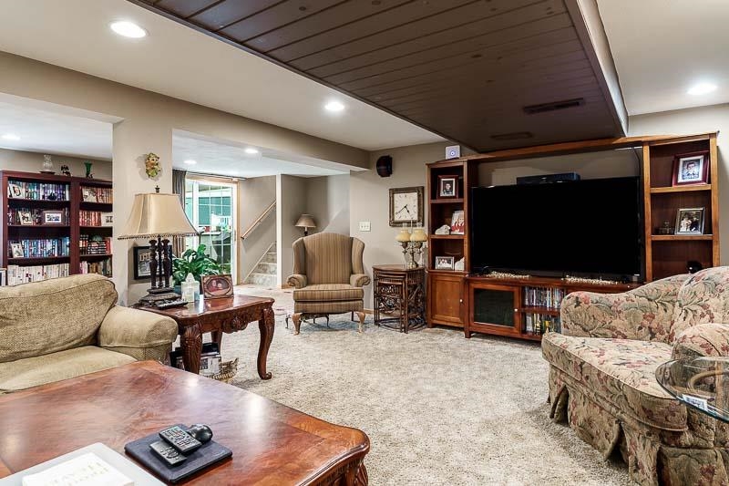 8410 Forest Preserve Road Durand, IL 61024 - Photo 20 of 37 a living room with furniture and a flat screen tv