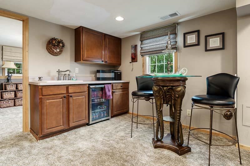 8410 Forest Preserve Road Durand, IL 61024 - Photo 22 of 37 a view of a kitchen with a stove a refrigerator and a refrigerator