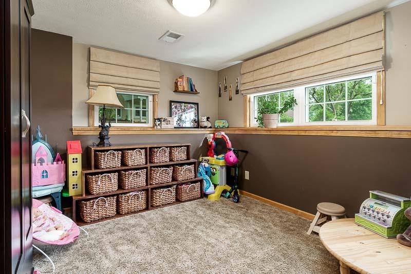 8410 Forest Preserve Road Durand, IL 61024 - Photo 23 of 37 a bedroom with furniture a bed and a window
