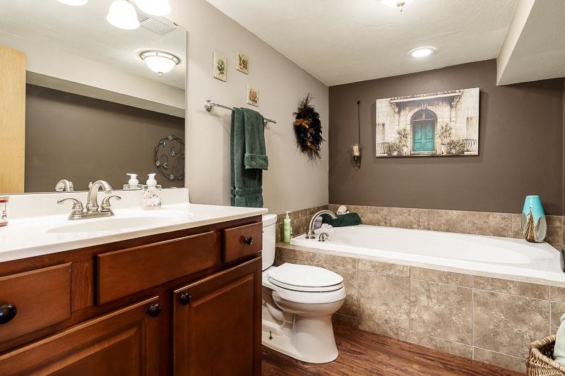 8410 Forest Preserve Road Durand, IL 61024 - Photo 24 of 37 a bathroom with a sink a toilet and shower