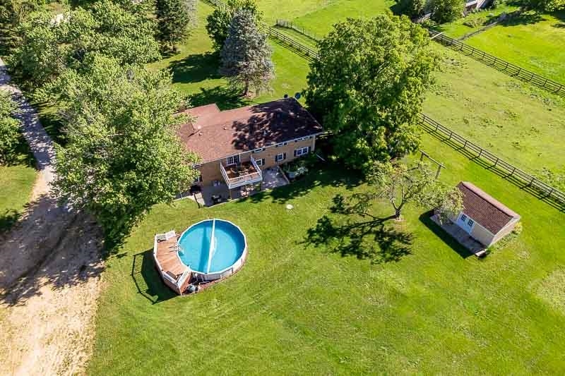 8410 Forest Preserve Road Durand, IL 61024 - Photo 29 of 37 an aerial view of a house with a yard and large trees