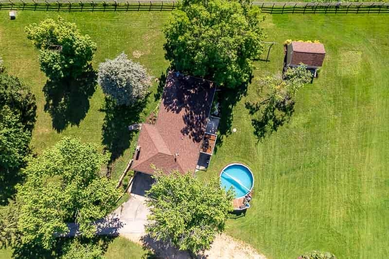 8410 Forest Preserve Road Durand, IL 61024 - Photo 30 of 37 an aerial view of a house with a yard swimming pool a patio and garden