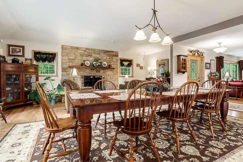 8410 Forest Preserve Road Durand, IL 61024 - Photo 7 of 37 a view of a dining room with furniture window and wooden floor