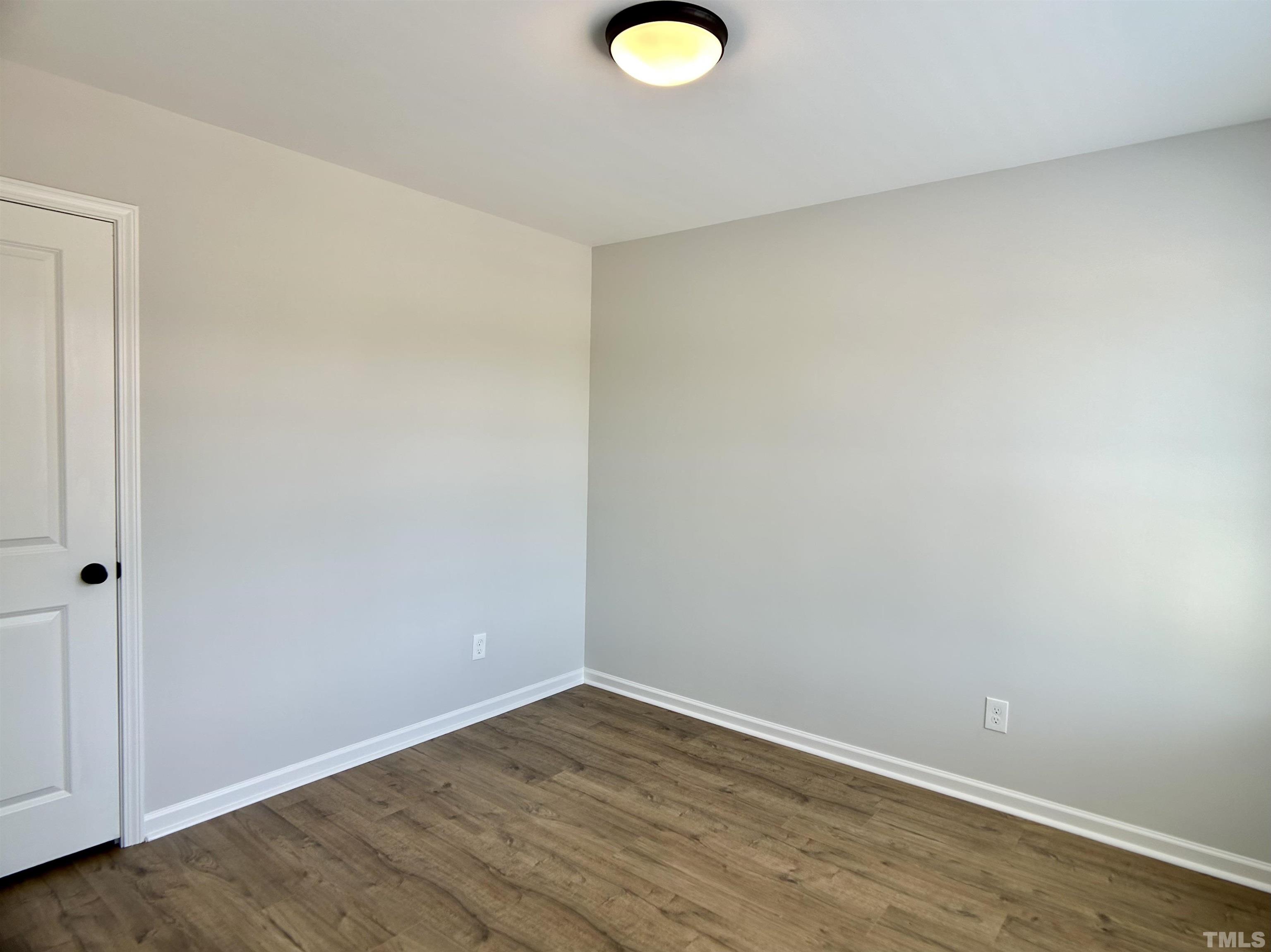 150 Greenview Street Clayton, NC 27520 - Photo 10 of 23 a view of empty room with wooden floor