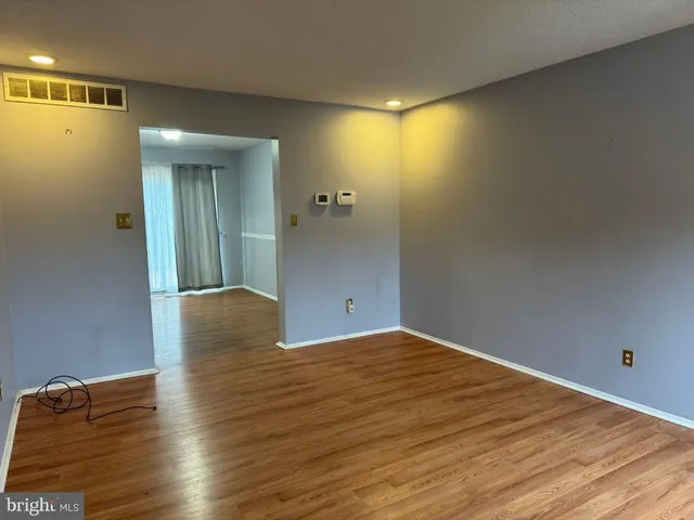 a view of a livingroom with wooden floor