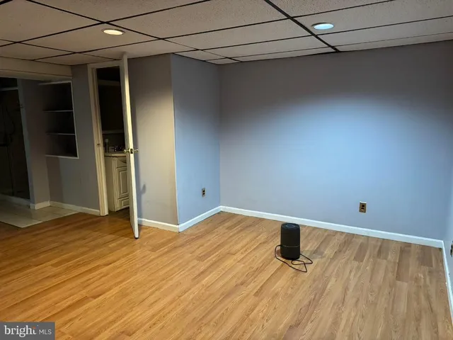 a view of a room with wooden floor