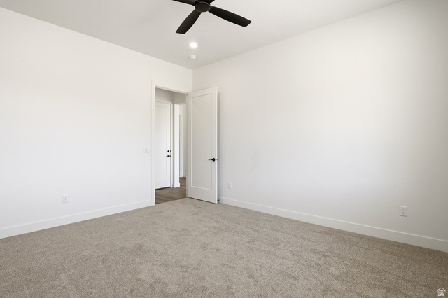 4978 North 75 East Enoch, UT 84721 - Photo 19 of 60 Spare room featuring carpet floors, ceiling fan, and recessed lighting