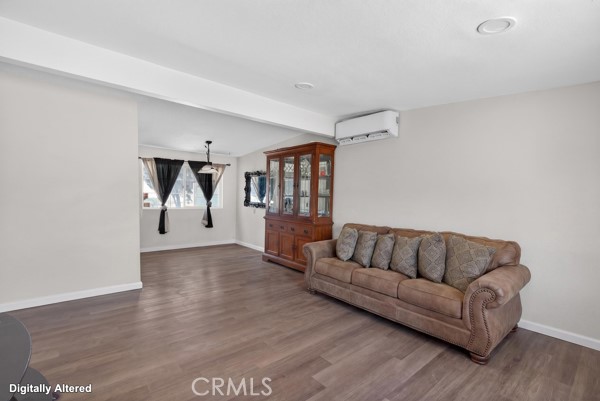 13391 Mesquite Road Whitewater, CA 92282 - Photo 27 of 27 a living room with furniture and a wooden floor