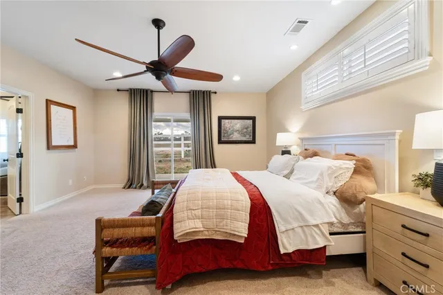 a view of a room with a large window and table chair