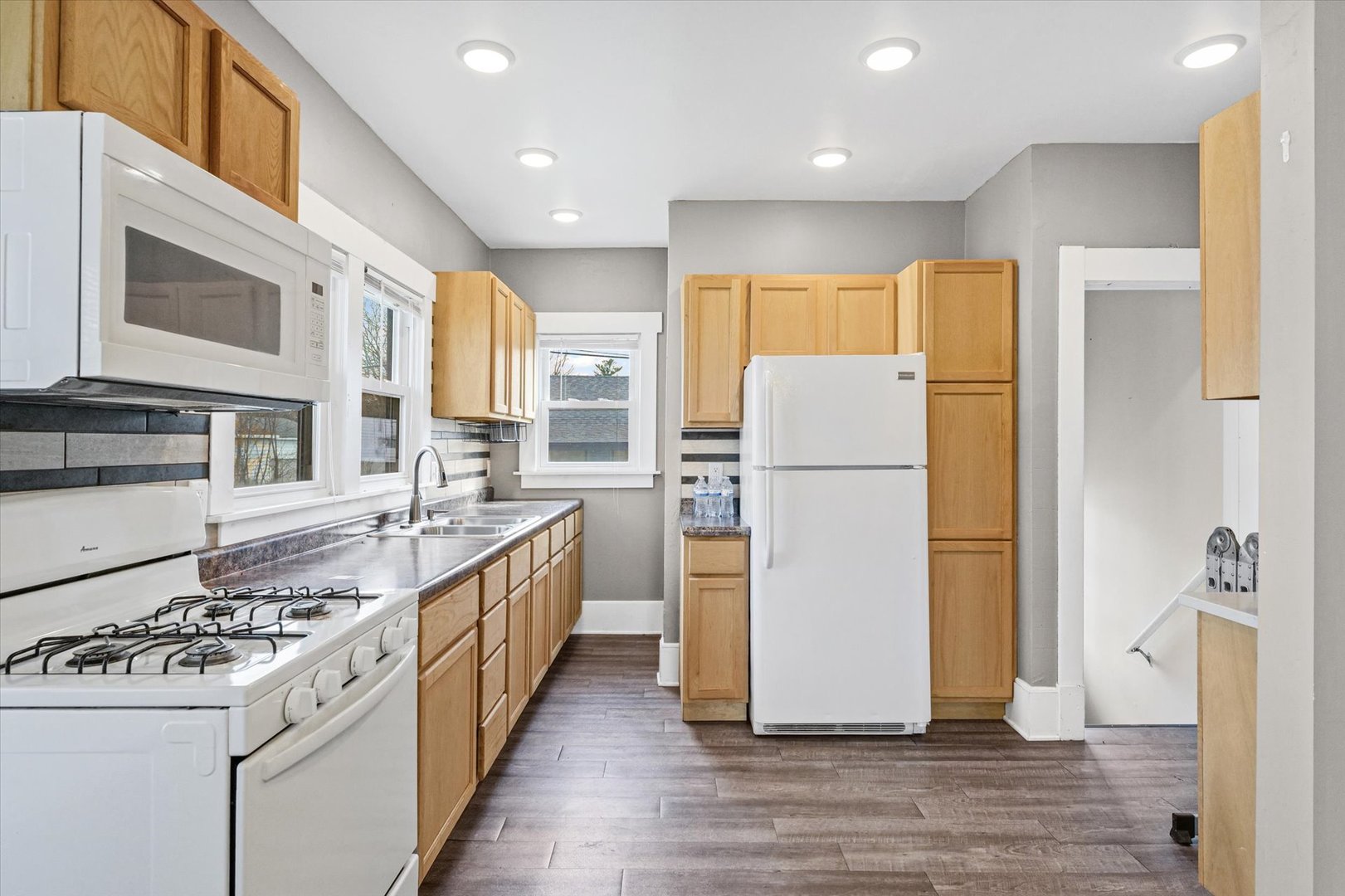 1311 West Hill Street Champaign, IL 61821 - Photo 11 of 27 a kitchen with a sink stove and refrigerator