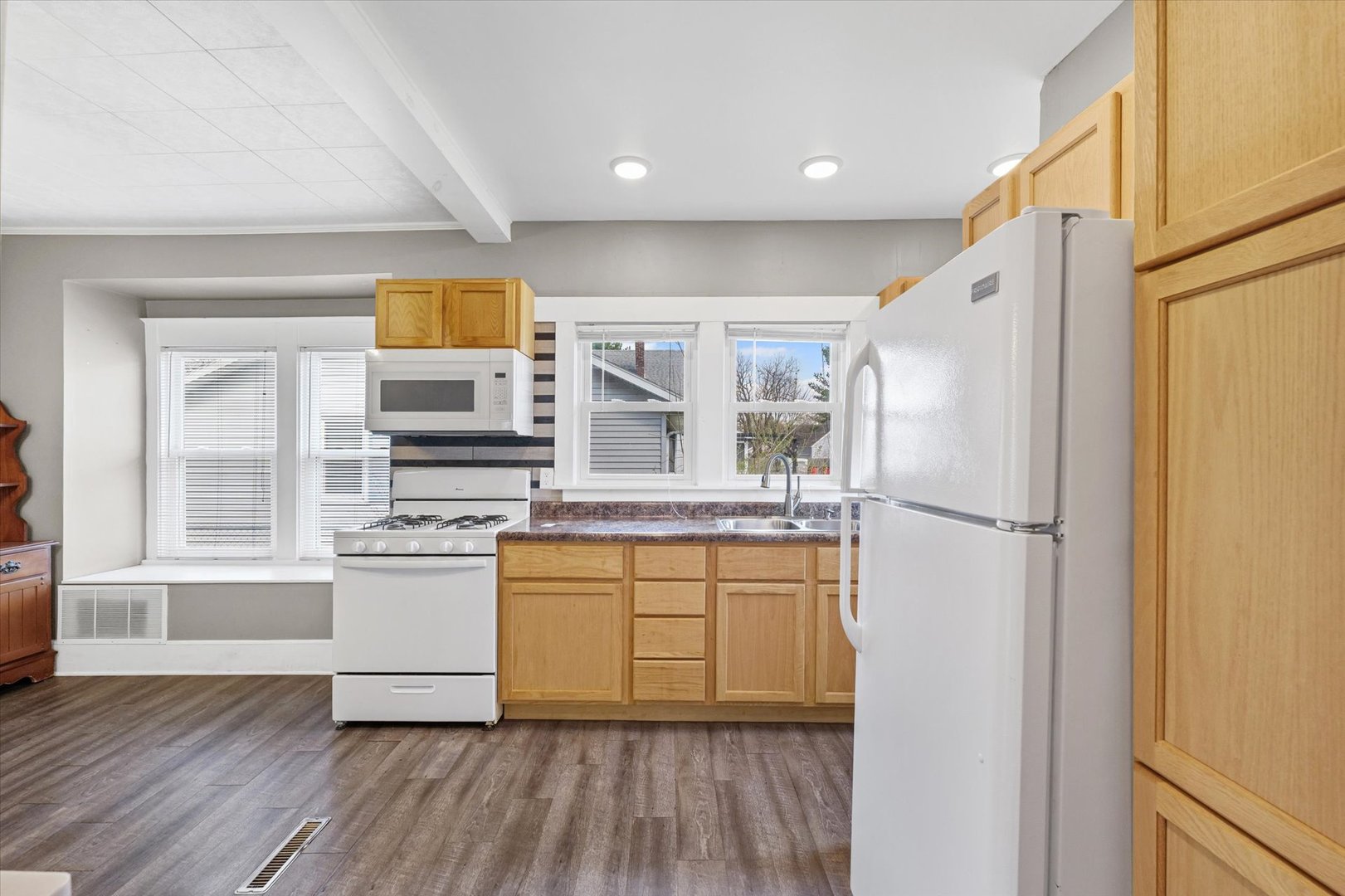 1311 West Hill Street Champaign, IL 61821 - Photo 13 of 27 a kitchen with stainless steel appliances a refrigerator and a stove top oven