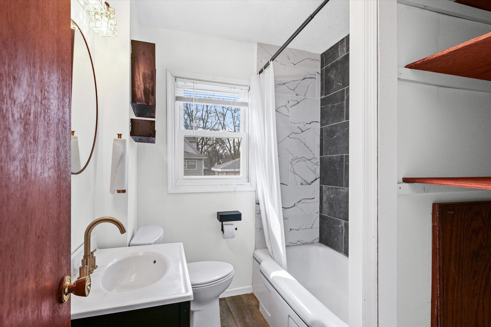 1311 West Hill Street Champaign, IL 61821 - Photo 17 of 27 a bathroom with a sink toilet and shower