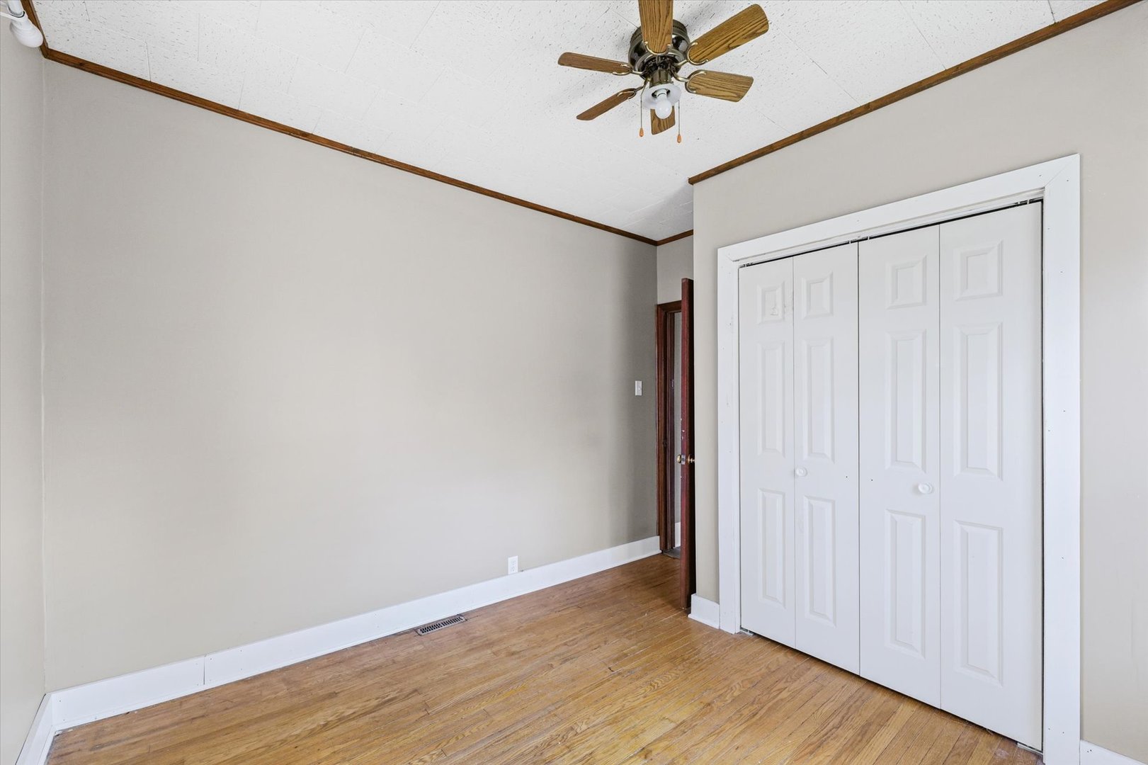 1311 West Hill Street Champaign, IL 61821 - Photo 19 of 27 a view of a room with wooden floor and closet area