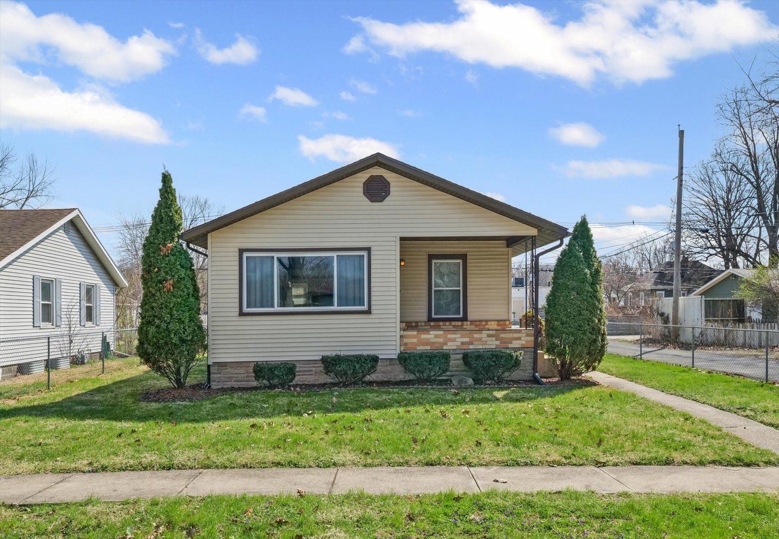 1311 West Hill Street Champaign, IL 61821 - Photo 2 of 27 a front view of a house with a yard