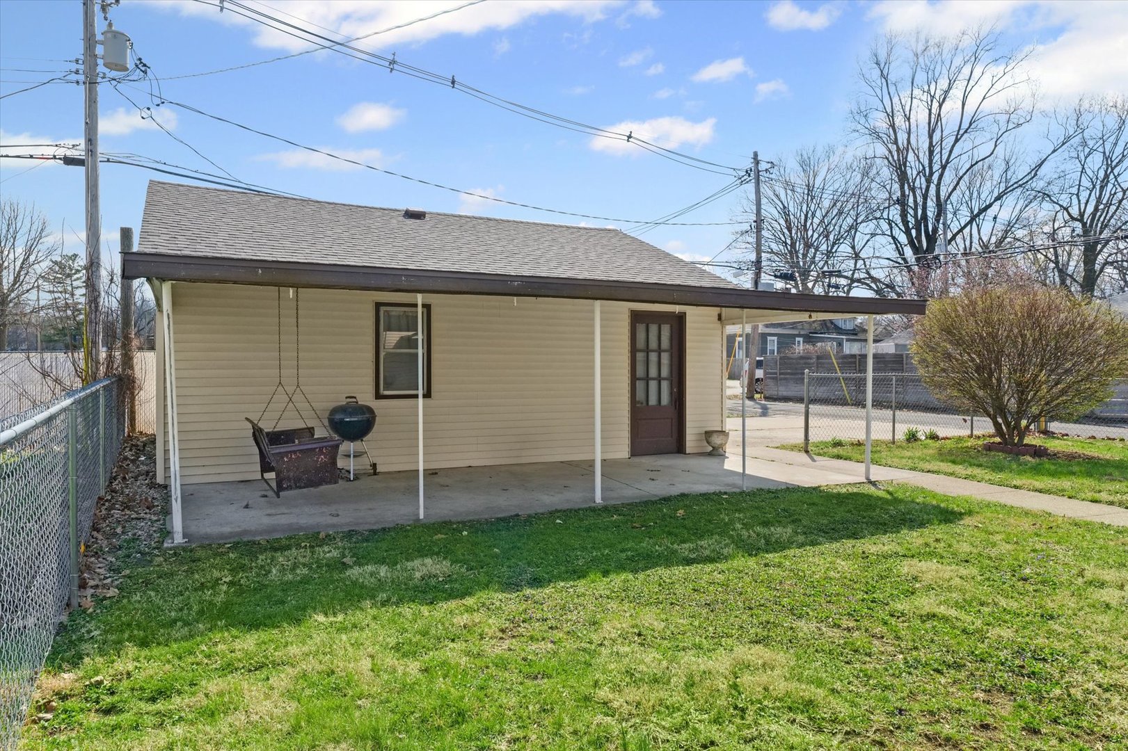 1311 West Hill Street Champaign, IL 61821 - Photo 25 of 27 a view of a house with a backyard and a patio