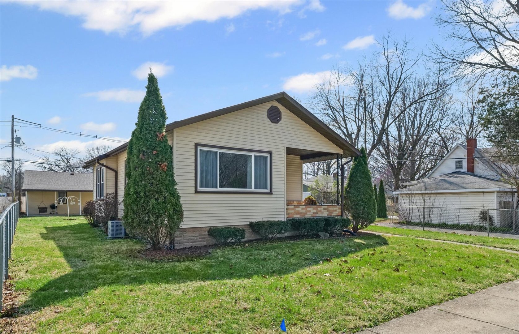 1311 West Hill Street Champaign, IL 61821 - Photo 4 of 27 a front view of a house with garden