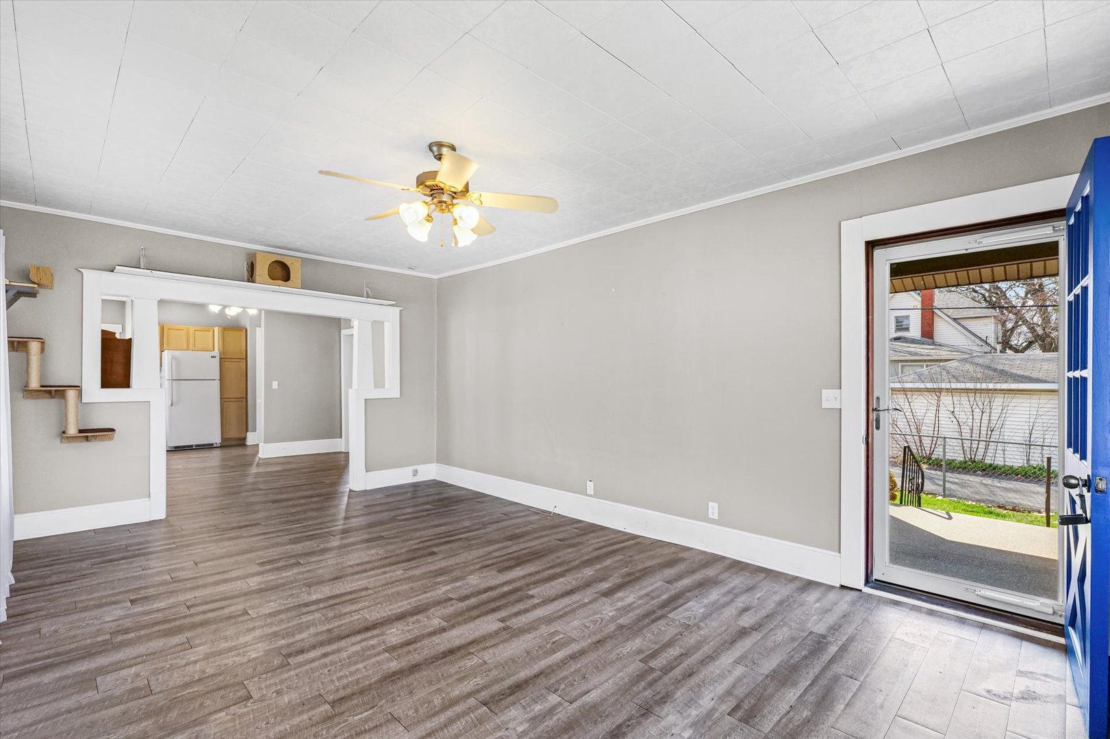 1311 West Hill Street Champaign, IL 61821 - Photo 6 of 27 a view of an empty room with window and wooden floor
