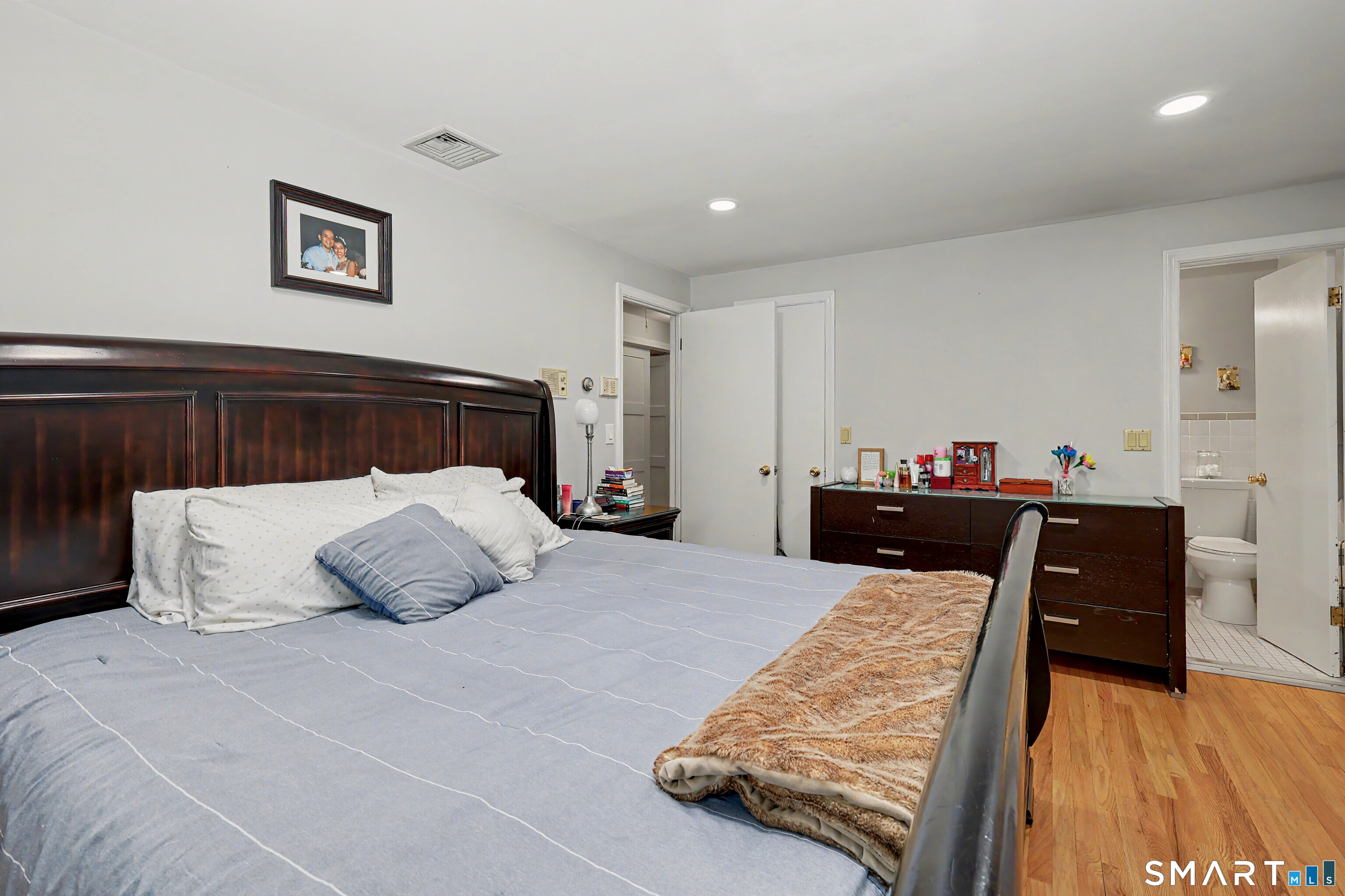 44 Haverhill Road Trumbull, CT 06611 - Photo 14 of 32 a bed room with a bed and a television