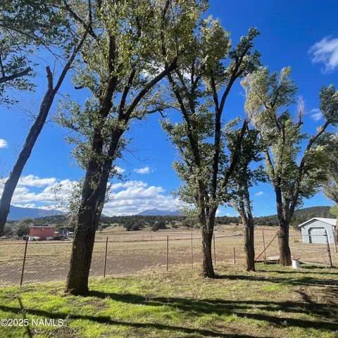 a bathroom with a sink a large mirror and a bathtub