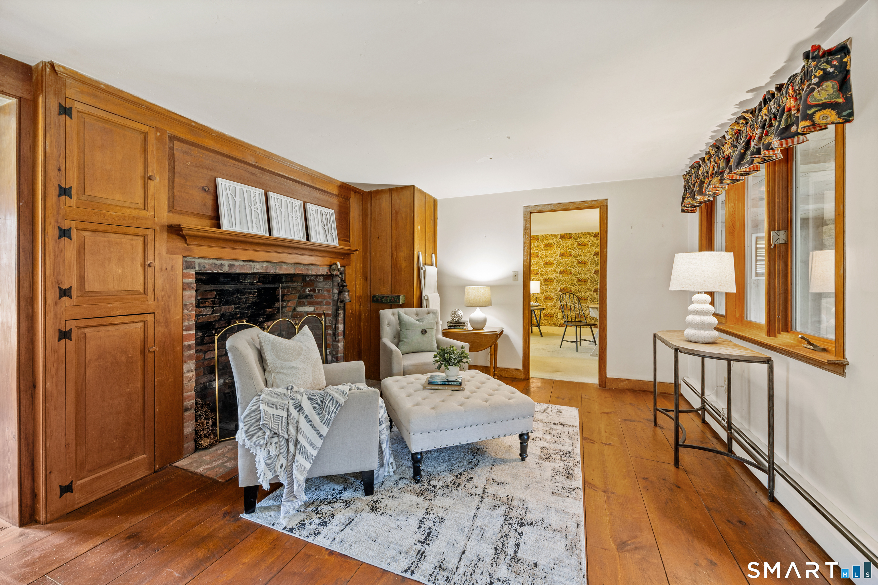 52 Susan Lane Meriden, CT 06450 - Photo 7 of 28 a living room with furniture fireplace and wooden floor