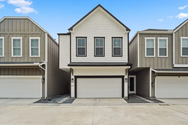 a view of house with garage