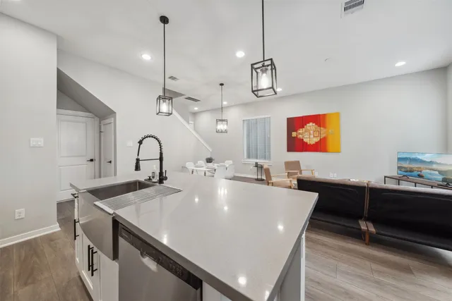 a large kitchen with a table and chairs