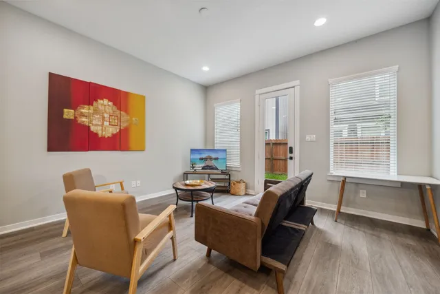 a living room with furniture and a large window