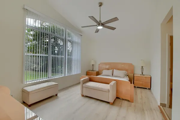 a bedroom with furniture and a window