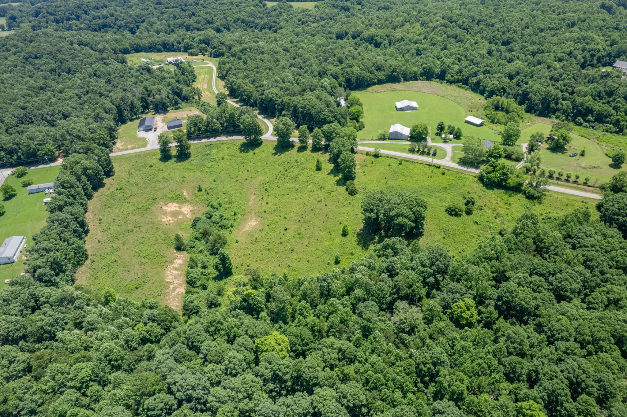 0 Mobley Ridge Road Duck River, TN 38454 - Photo 6 of 35 an aerial view of a house with a yard and large trees
