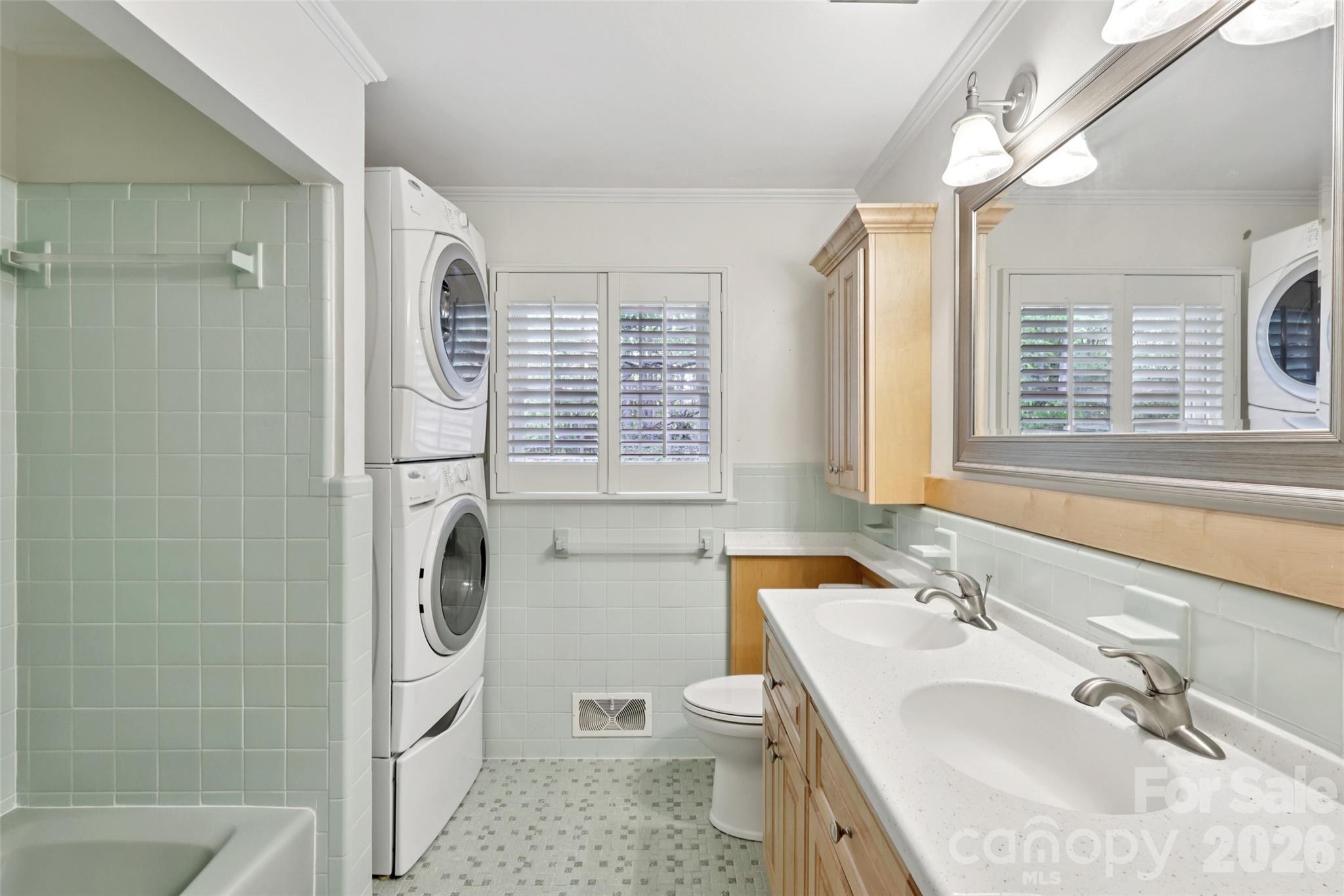 1002 Ridge Street Albemarle, NC 28001 - Photo 29 of 45 a bathroom with a sink a toilet and a shower