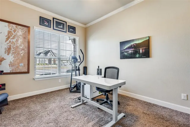 a work room with furniture and a window